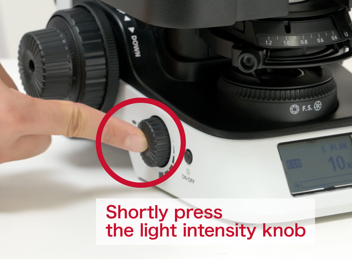 press and hold the light intensity knob on the left side.